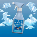 A spray bottle of A4 Freshener Fabric Refresher Fresh Linen, shown against a blue sky background with white clouds and floating white garments.