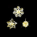 Three gold and white hanging Christmas star ornaments displayed against a solid black background.