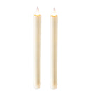 Two cream-colored pillar candles with realistic flame tops, shown standing upright against a solid white background.